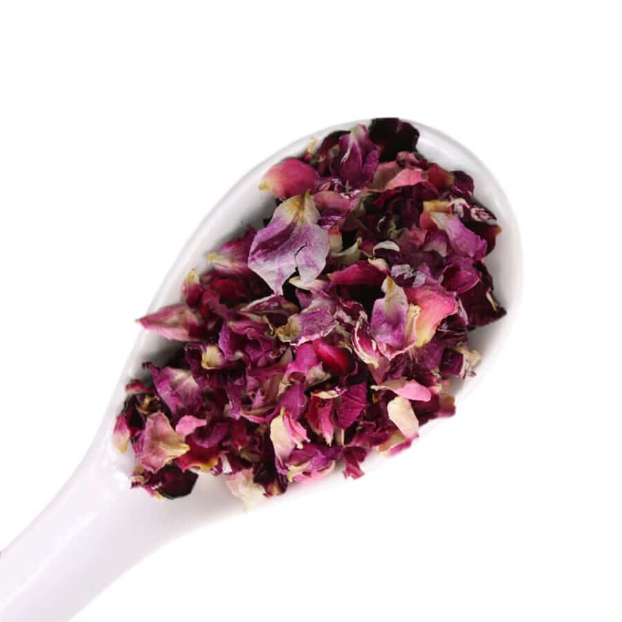 dried rose petals edible flowers on a white spoon