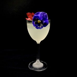 Queens Jubilee Cocktail topped with Edible Flowers