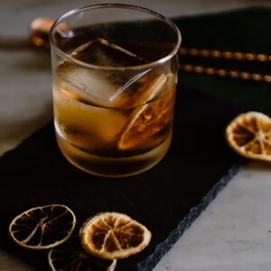 Iced Cocktail with Dried Orange & Lemons
